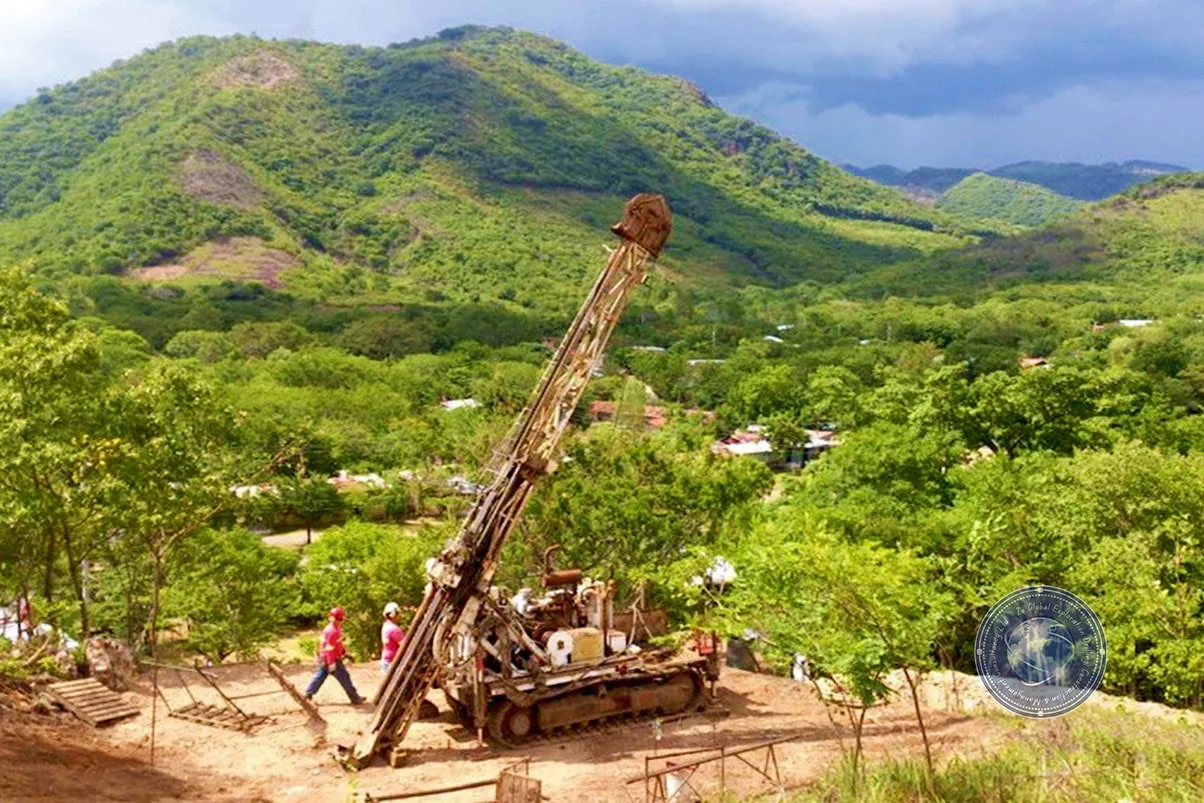 Field engineer supervising precision exploration drilling rig in Ghanaian terrain